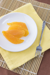 Dried mango in white dish ready to eat (Top view)