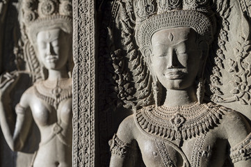 Angkor Wat sculptural relief in stone carvings of dancing apsara ladies