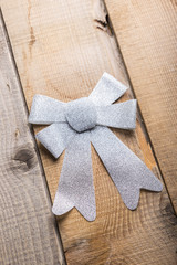 Christmas decorations bow on  wooden background