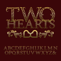 Gold patterned letters with tendrils. Vintage font in romantic style. Isolated english alphabet with text Two Hearts.