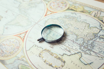 Fototapeta na wymiar Magnifying Glass and Ancient Old Map