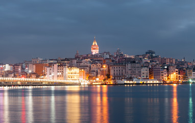 Fototapeta na wymiar Nighte cityscape with Galata Tower over the Golden Horn in Istanbul, Turkey
