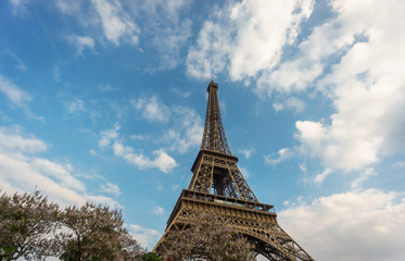 The Eiffel Tower against clouds and sky in Paris, France