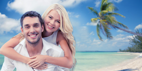 Fototapeta na wymiar happy couple having fun over beach background