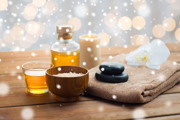 Fototapeta na wymiar sea salt, massage oil, honey and bath towel