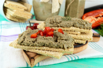 Gentle paste, paste from the eggplant. Dietary dish. Put on a crisp low-calorie diet fitness bread. Vegan cuisine. For picnic. Close up