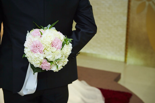 Groom Holding Wedding Bouquet 