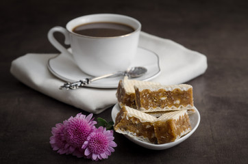 Wafers puff cakes with caramel and a cup of coffee