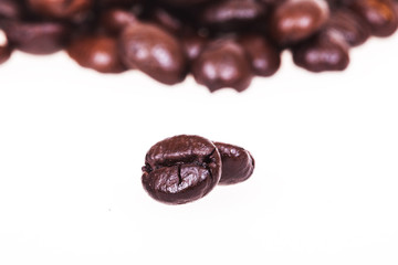 roasted coffee beans isolated in white background