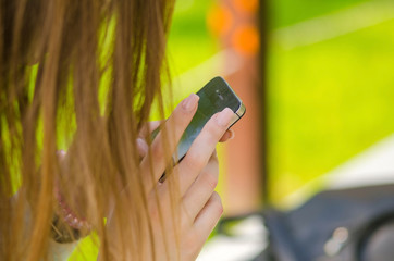 Young woman using her phone