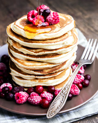 Close up pancake with berriesand honey