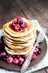 Pancakes with berries on plate