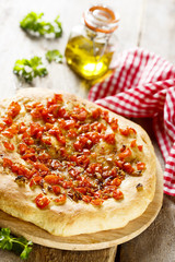 Focaccia bread with tomatoes and garlic