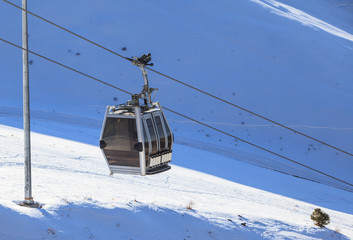 Cable way or ski lift in mountain ski resort Shymbulak, Kazakhstan 
