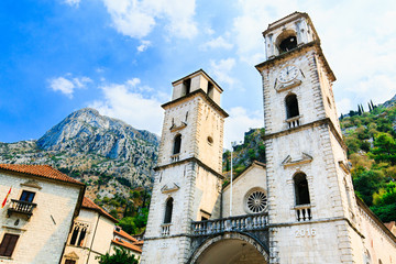 Fototapeta na wymiar Cathedral Saint Tryphon is Roman Catholic cathedral in old town of Kotor, Montenegro. Lovcen mountain at background.