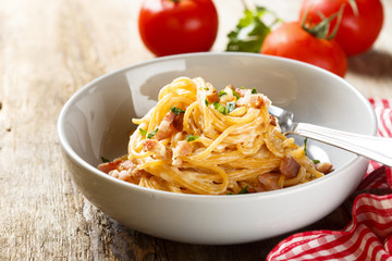 Tomato pasta with egg sauce, cheese and ham