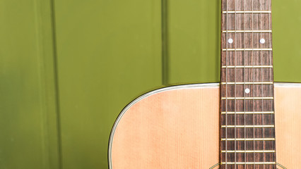musical background image of acoustic guitar focus on strings with text area, very shallow depth