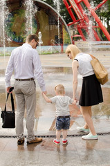 Young family is walking in the park