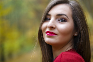 Beautiful woman in autumn park