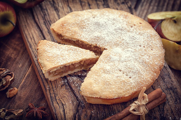 Homemade Apple tart with cinnamon and copy space 