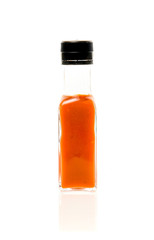 Different color home made hot sauce in glass bottles