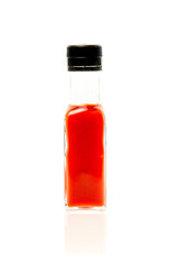 Different color home made hot sauce in glass bottles