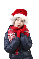 Little girl in winter clothes and Santa helper hat over white background