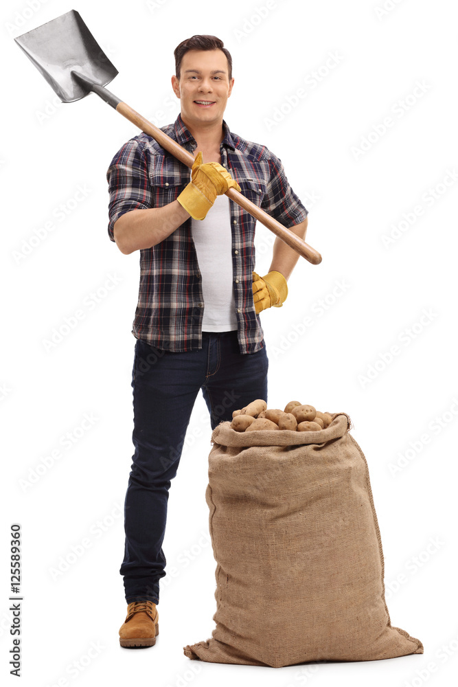 Poster Male agricultural worker posing with shovel and burlap sack