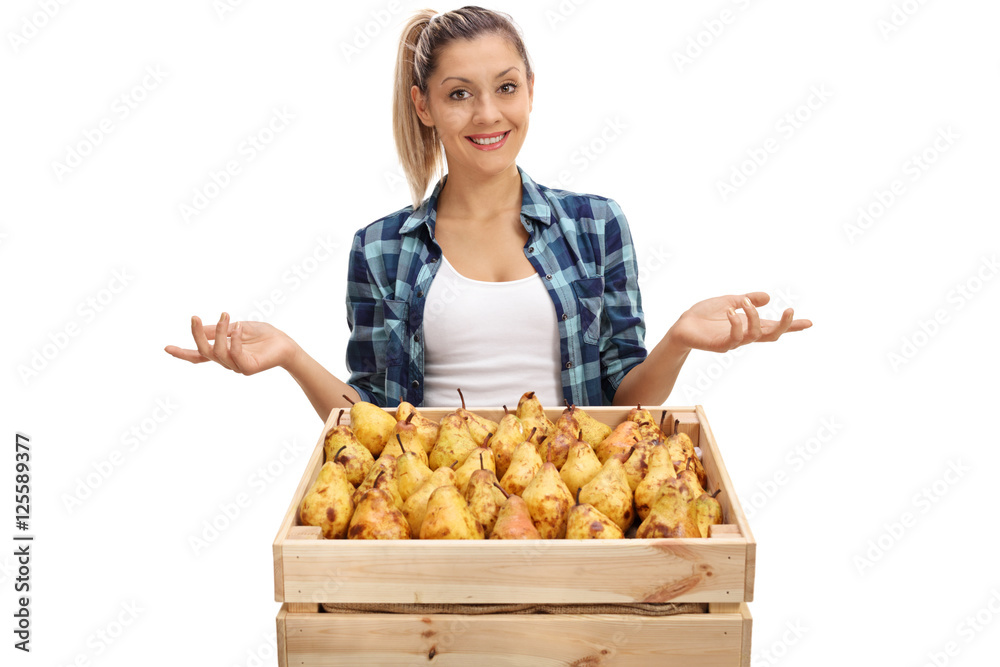 Wall mural Female farmer posing with crate and gesturing with hands