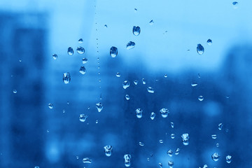 Water drops on turbid window glass