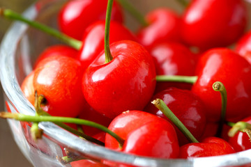 red cherries in a glass fruit dish