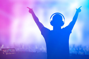 Charismatic disc jockey at the turntable.