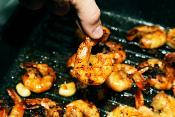 Shrimps fried. Macro photograph of a shrimp and garlic stew