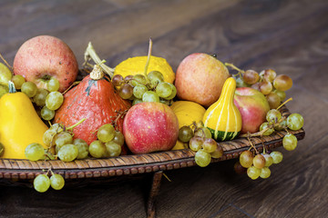 autumn pumpkins in basket for home decoration