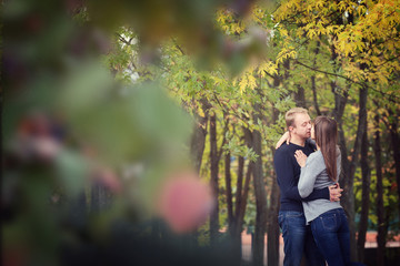 Fototapeta premium Happy couple kissing outdoors