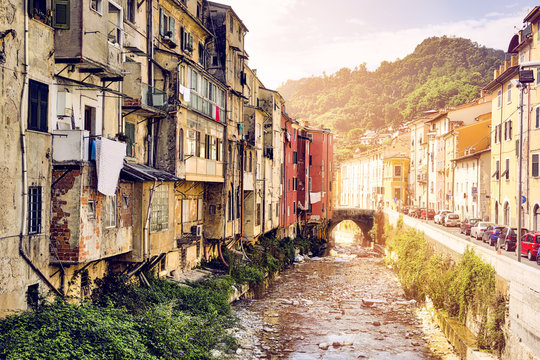 Fototapeta Carrara Italy, creek and old poor houses