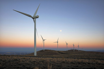 Wind turbines at moonrise on the Wild Horse Wind and Solar Facility in Ellensburg, Washington.