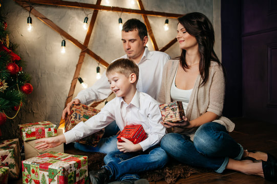 happy young family in Christmas decorations