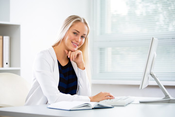 Young business woman with computer