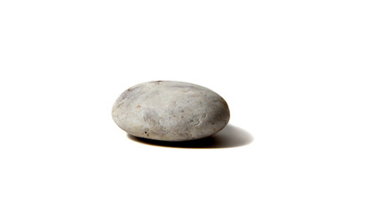Fototapeta na wymiar Small rock stone, isolated on white background- Abstract concept