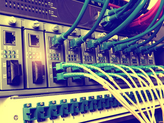 Fiber Optic cables connected to an optic ports and Network cable