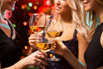 Happy young women with glasses of champagne.