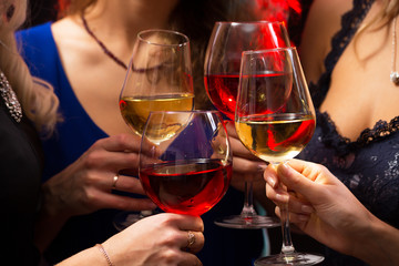 Happy young women with glasses of champagne.