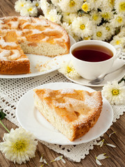 Delicious apple pie and tea on old blackboard