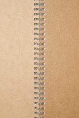 Brown spiral cardboard notebook for background