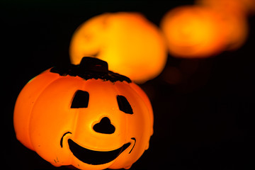 Pumpkin lights with smiley face in a row