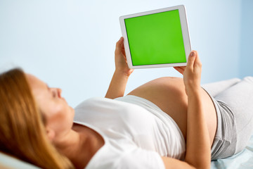 Pregnant woman with touchpad