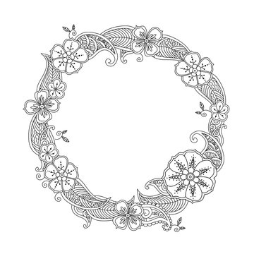 Floral hand drawn round frame in zentangle style isolated on white.