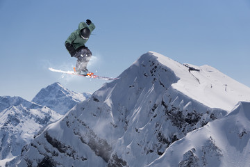 Ski rider jumping on mountains. Extreme freeride sport.