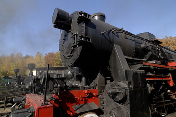 Old Vintage Steam Locomotive At The Train Depot
